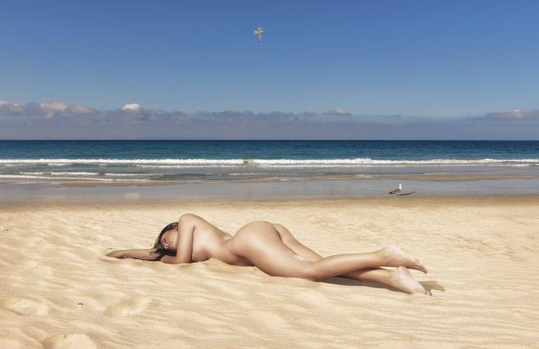 woman tanning nude