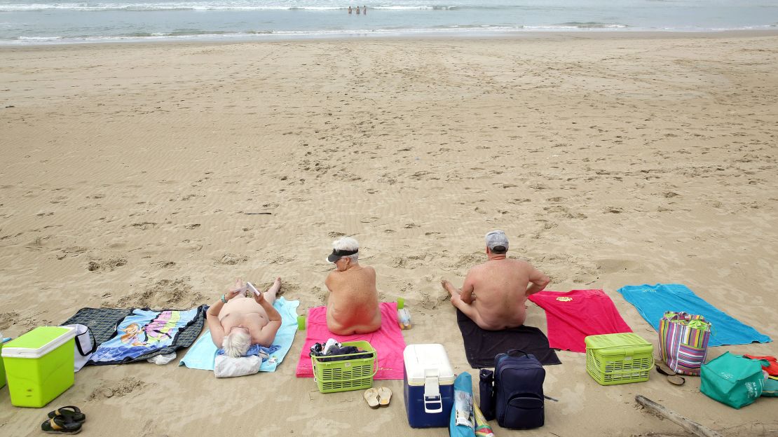 legs spread nude beach